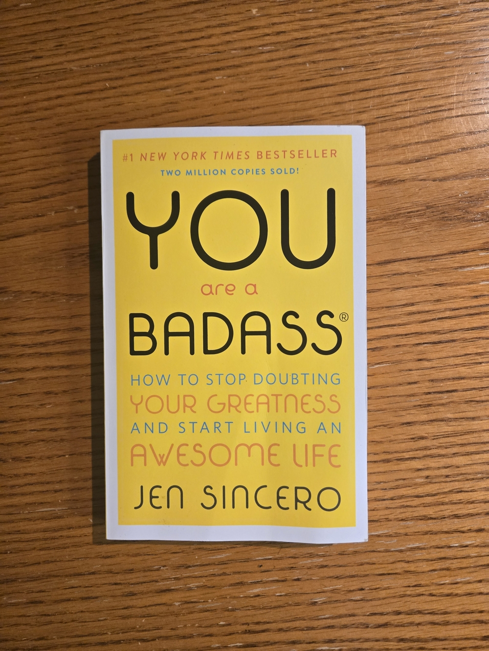 You Are a Badass by Jen Sincero - Yellow Paperback Self-Help Book